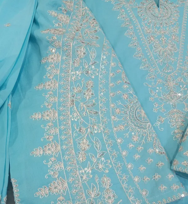 White embroidered flowers on sky-blue fabric
